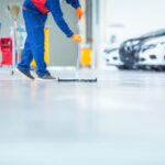 car mechanic repair service center cleaning using mops roll water from epoxy floor car repair service center (1)
